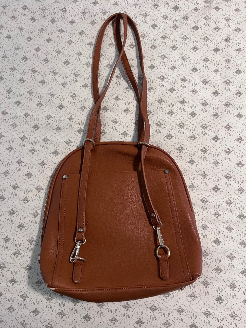 Brown convertible shoulder bag and backpack